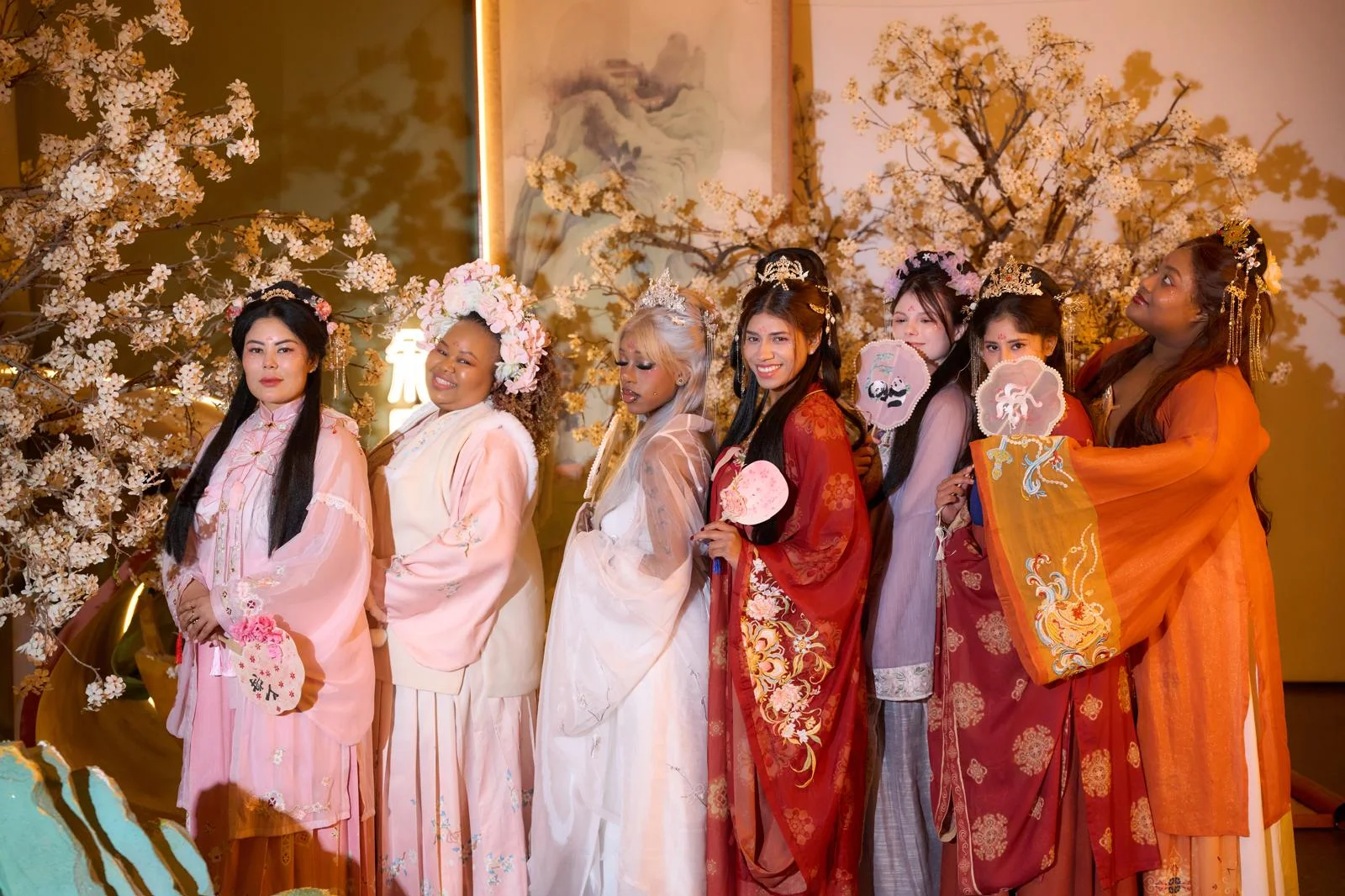 Travelers posing together in traditional Chinese dress