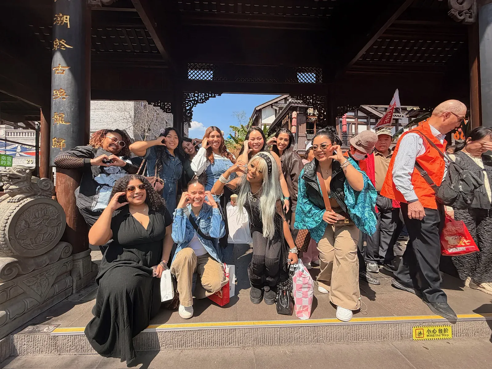 The travel group posing together while exploring a temple