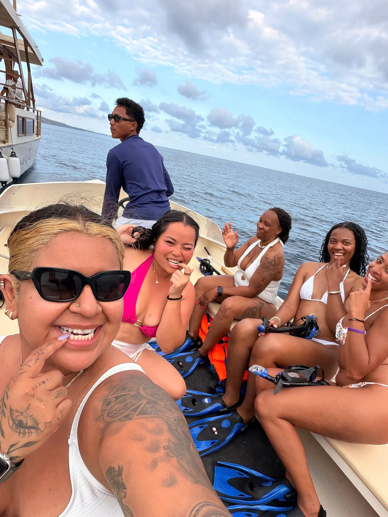 Friends enjoying a catamaran day together on the water