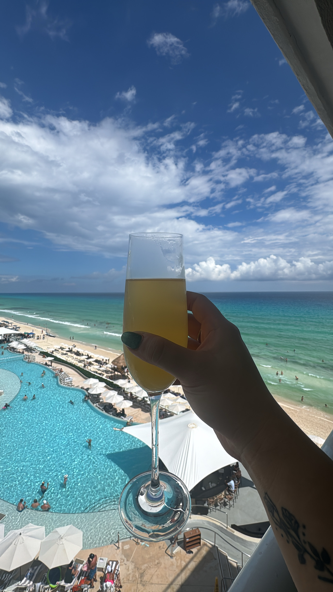 Champagne toast overlooking the pool and Caribbean Sea